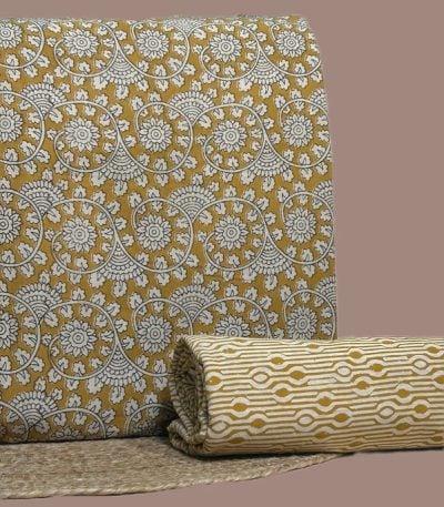 Yellow Bagru blockprint cotton set with floral swirl top and geometric stripe bottom.
