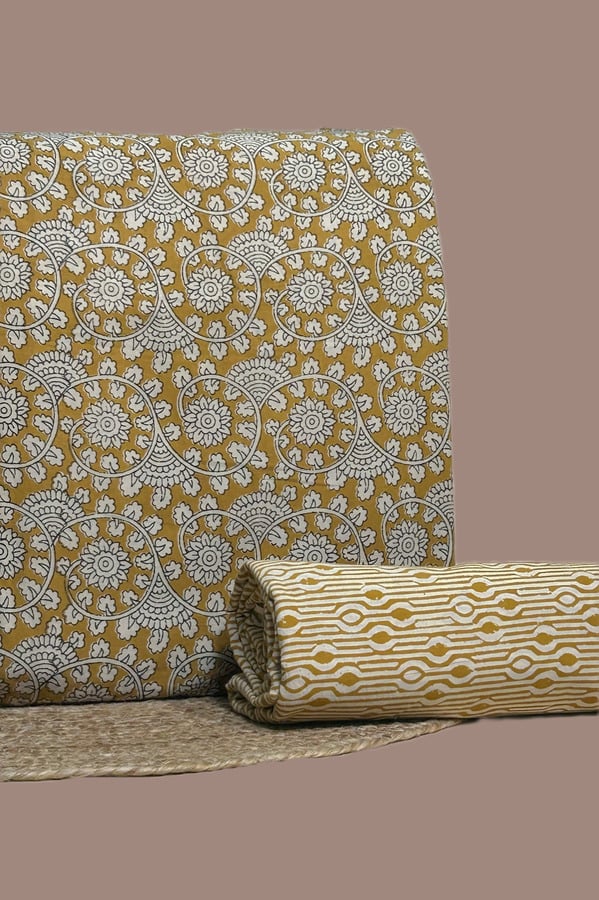 Yellow Bagru blockprint cotton set with floral swirl top and geometric stripe bottom.