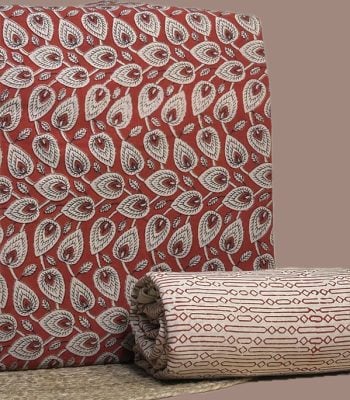 Red Bagru blockprint cotton set with leaf motif top and geometric stripe bottom.
