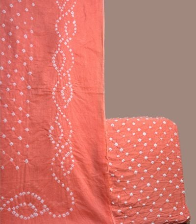 Coral pink bandhani cotton dupatta with wave dot pattern and dotted top.