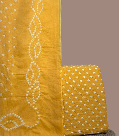 Yellow bandhani cotton dupatta with wave dot pattern and dotted bandhani top.