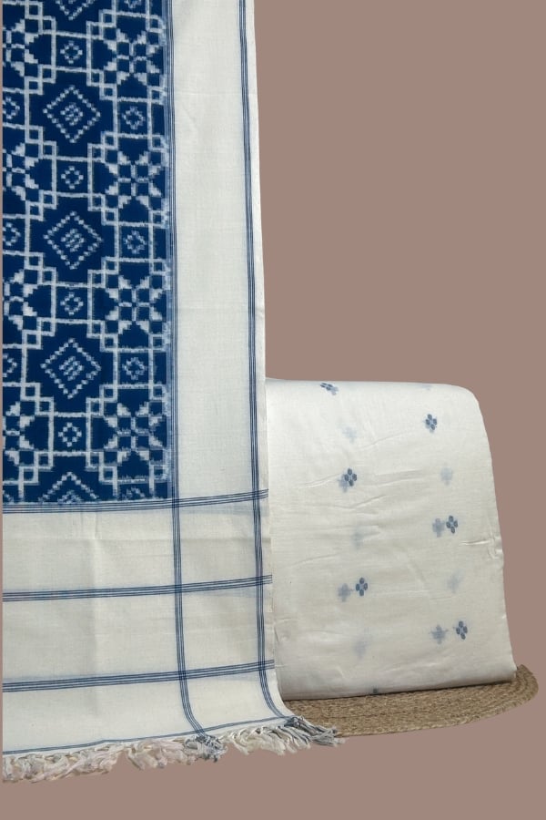 Blue teliya patola ikkat dupatta with white handloom jamdani buti woven top.