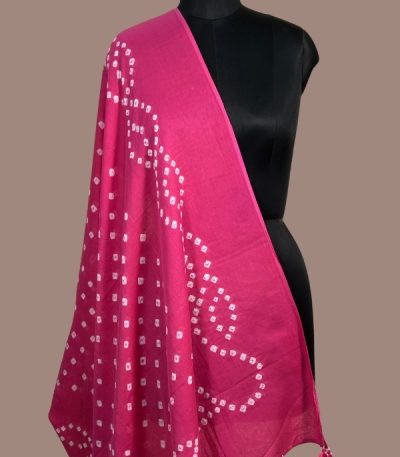 Rani pink bandhani cotton dupatta with white wave dot pattern and tassels. Authentic Hand Tie Dye Bandhani