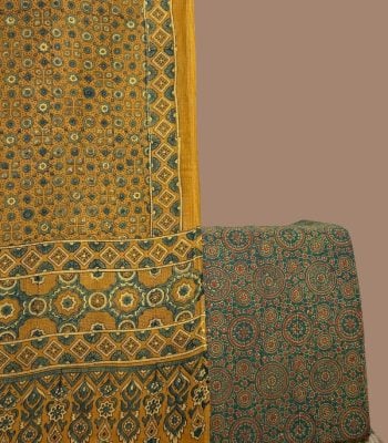 Mustard Ajrakh geometric dupatta paired with deep green Ajrakh medallion print top.